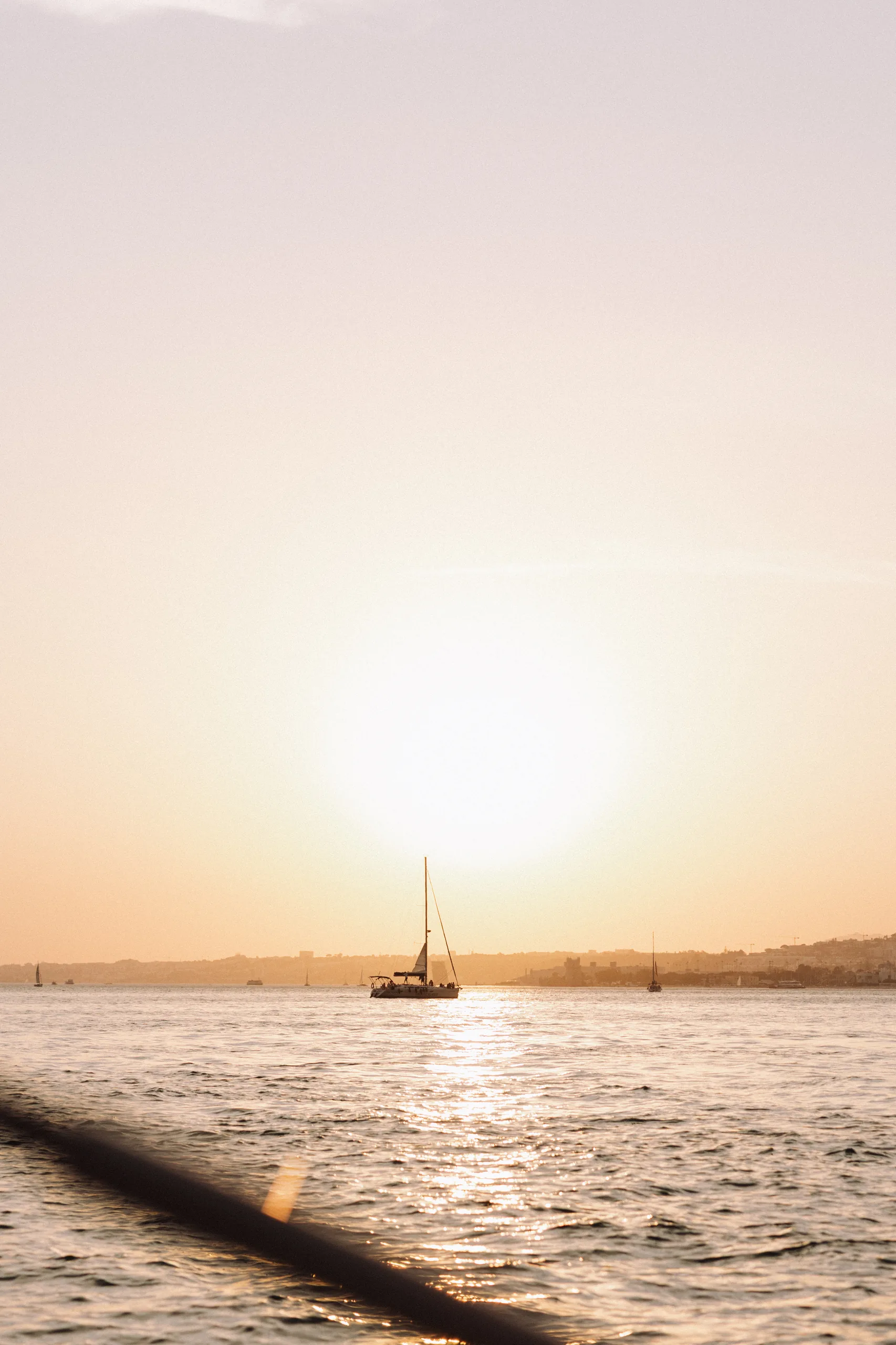 Boat on the River Tagus at sunset in Lisbon
